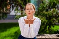 Blow kiss, young caucasian female haired model Royalty Free Stock Photo