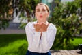 Blow kiss, young caucasian female haired model Royalty Free Stock Photo