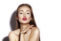 Blow sweet kiss. Beautiful woman with fashion lips make-up on white background. Valentines day Makeup. look