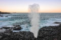 `Little Blowhole`, Kiama, NSW, Australia. Waterspout and seascape at sunset Royalty Free Stock Photo