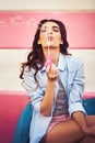 Blowing bubbles could make anyone happy. a beautiful young woman blowing bubbles outside. Royalty Free Stock Photo