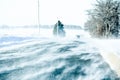 Blowing and Drifting Snow Across Road