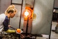 Blowing Glass Professional Woman Working on a Vase.