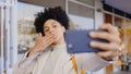 Blowing, kiss and selfie of woman in city with profile picture, photography and social media. Happy, gesture and person Royalty Free Stock Photo