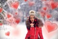 Blowing kiss.Woman in snowy winter. Girl enjoying in the snow