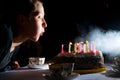 Blowing out candles on cake Royalty Free Stock Photo