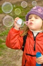 Blowing soap bubbles out Royalty Free Stock Photo