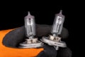 Blown bulbs on a man's gloved hand. Replaceable car accessories for headlights Royalty Free Stock Photo