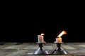 Blown candles in silver candlesticks with smoked wick. Smoke fro Royalty Free Stock Photo