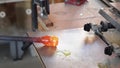 Rolling frit onto hot glass