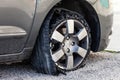 Blown out tire with exploded, shredded and damaged rubber