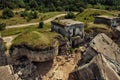 Blown up german military forts on the beach under blue sky drone photo