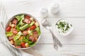 BLT Salad has a homemade ranch dressing, crispy bacon, croutons, lettuce and tomato closeup on the plate. Horizontal top view Royalty Free Stock Photo