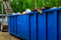 Blu dumpster, recycle waste recycling container trash on ecology and environment Royalty Free Stock Photo