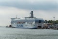 Blu and white Silia Line ferry is moored in port.