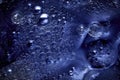 Blue abstract background with agglomeration of moving bubbles