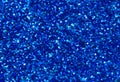 Blue abstract background. Blue glitter closeup photo. Dark blue shimmer wrapping paper.