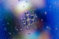 Blue abstract background with oil drops. Colourful backdrop with water and round bubbles with space for your text. Royalty Free Stock Photo