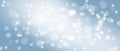 Blue abstract background. white light and snowflakes bokeh winter for Christmas new year blurred beautiful shiny lights Royalty Free Stock Photo