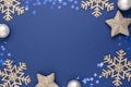 Blue abstract Christmas background frame with silver snowflakes, baubles and confetti winter decoration, blue mock up with space Royalty Free Stock Photo