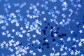 Blue abstract Christmas background or texture with stars confetti on blue background Royalty Free Stock Photo