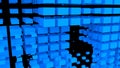 Blue abstraction with lots of cubes. Abstract background with flying blue cubes on a black background. 3D image. Royalty Free Stock Photo