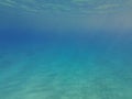 The blue abyss of the Mediterranean Sea. Sun rays under water. Blue water of the earthly sea