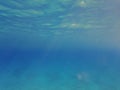 The blue abyss of the Mediterranean Sea. Sun rays under water. Blue water of the earthly sea