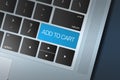 Blue Add to Cart Call to Action button on a black and silver keyboard Royalty Free Stock Photo