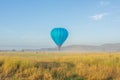 Blue air balloon flying in the air during daytime Royalty Free Stock Photo