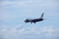 Blue Air Boeing 737-500 YR-BAG, blue sky with clouds Royalty Free Stock Photo