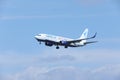 Blue Air Boeing 737-800 YR-BAH, blue sky with clouds Royalty Free Stock Photo