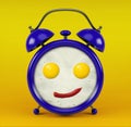 Blue alarm clock with funny face omelet concept - isolated on yellow