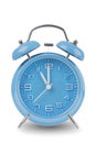 Blue alarm clock with the hands at 11 am or pm isolated on a white background