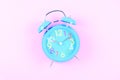 Blue Alarm clock on pink pastel background or isolated Royalty Free Stock Photo