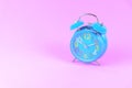 Blue Alarm clock on pink pastel background or isolated Royalty Free Stock Photo