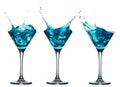 Blue alcohol cocktail set with splash on white