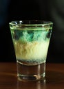 Blue alcohol drink in clear shot glass Royalty Free Stock Photo