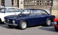 Blue Alfa Romeo Giulia GT, sixties vintage coupe car. Side view.