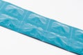 Blue aluminum foil blister strip on white