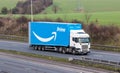 Blue Amazon lorry in motion on the British motorway M1 Royalty Free Stock Photo