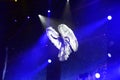 White Angel on Blue Background Spotlights, Aerial Performance, Circus Artist