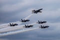 Blue Angels formation planes flying over Houston against a cloudy sky, United States Royalty Free Stock Photo