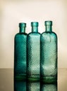 Blue antique glass bottles in back-light Royalty Free Stock Photo