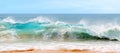 Blue and aquamarine color sea waves and yellow sand with white foam. Marine beach background. Banner format. Royalty Free Stock Photo