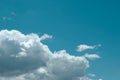 Blue aquamarine sky with dramatic cumulus clouds. Toned background, copy space and place for text Royalty Free Stock Photo