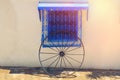 Blue arabic house window and cart wheel in Sidi Bou Said, Tunisia