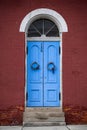 Arch-shaped door on the old red building