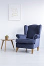 Blue armchair and side table Royalty Free Stock Photo
