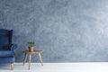 Blue armchair and wood side table Royalty Free Stock Photo